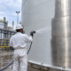 Spray application of thermal insulation coating Aes Techon an industrial metal storage tank
